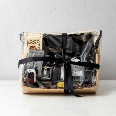 Premium connoisseur gourmet hamper featuring honey, specialty oil, condiments, coffee, hot chocolate, chocolate, Rocky Road and tonic.